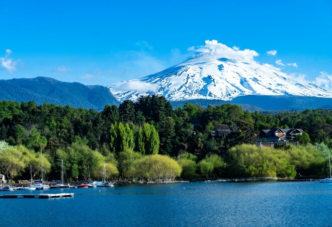 A view of Villarrica Lake and a snow-covered moutain behind it in Pucón, Chile